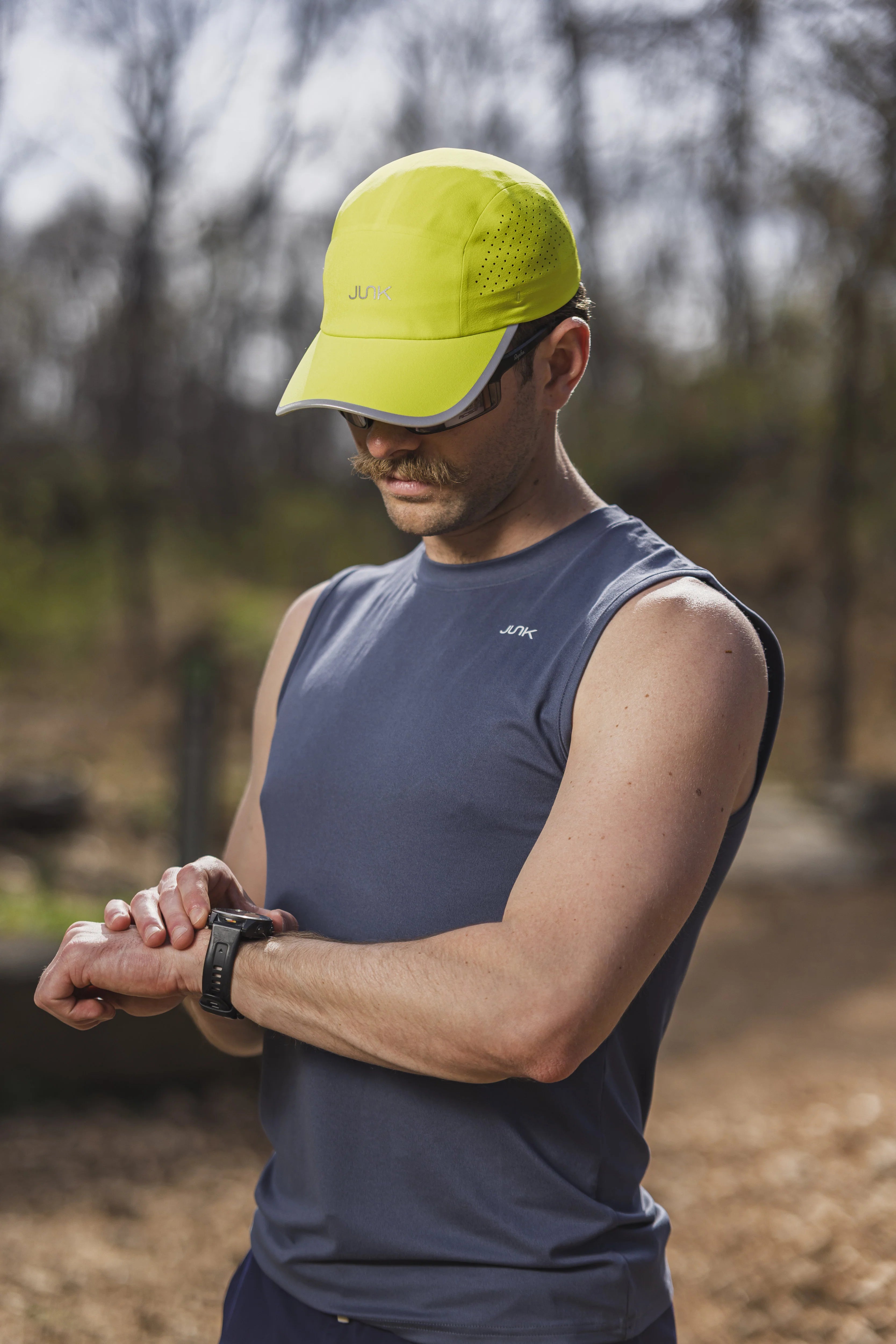 Athlete wearing a bright performance hat outdoors